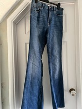 Stradivarius size 12 ladies flared jeans with stretch and frayed hem