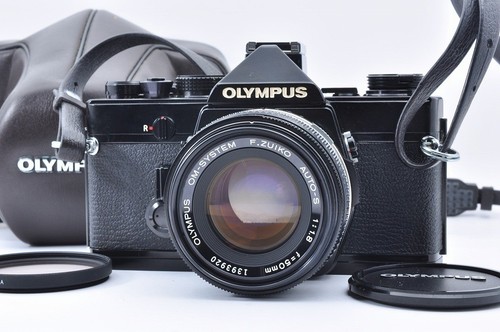Olympus black 35mm slr - om-1,