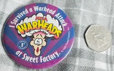 MEGA - WARHEADS, I SURVIVED A WARHEAD ATTACK - AT SWEET FACTORY, BUTTON BADGE.