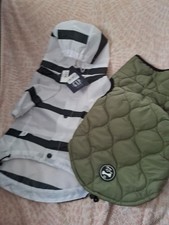 2  DOG COATS.  One is GAP make l.  One is Harvey Jones. Never  worn. Size S.