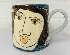 Karen Atherley Ceramics - Blue cylinder mug with female face