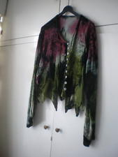 multi coloured velvet suit with embroidery and crochet type godets.