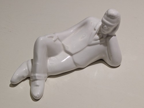 Man reclining white ceramic - man,