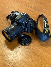 Nikon D300 with 18-200mm zoom lens plus soft leather case