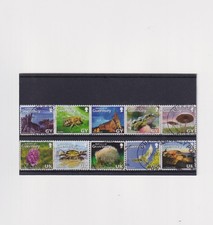 Collection of Guernsey stamp sets NVI modern values GSY & UK