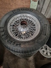  wheel with A Pirelli P4000 Super Touring tire, likely from 1960s Jaguar E-Type