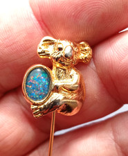 Koala Bear Holding An Opal