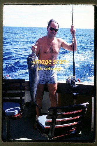 Man deep sea fishing - on,