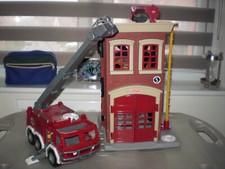 LARGE FISHER PRICE FIRE ENGINE TOGETHER WITH MATCHING FIRE STATION