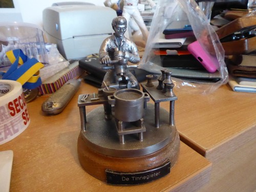 Pewter model stand of a - model, on