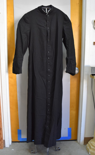 Older used black cassock - older,