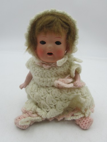 Small antique celluloid doll - small,