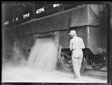 Man overseeing grain being
