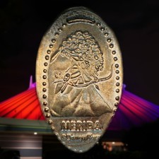 Merida holding a bow with