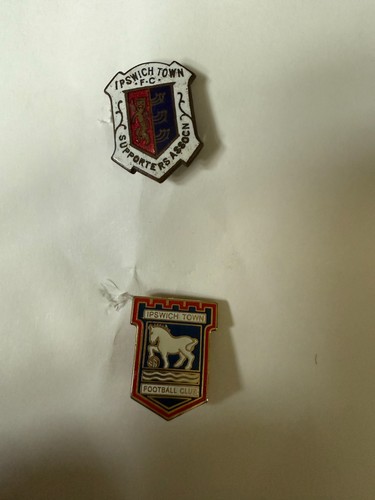 Two pin badges - , owned