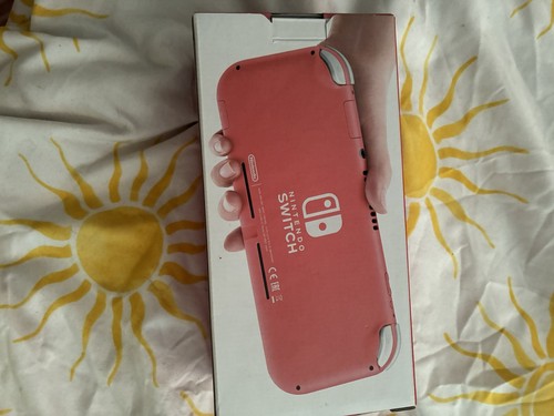 Nintendo switch lite coral - nintendo,