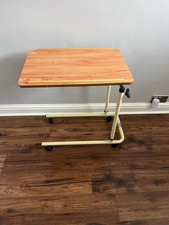 Used Adjustable Hospital type bed table with wheels. Ideal for Bed or Chair