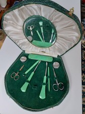 1930's Manicure Set. Green  Leather Case With 2 Clasps. A Nail File Is Missing.