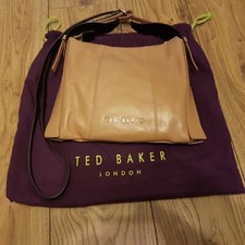 Iconic French bulldog lined tan leather bag