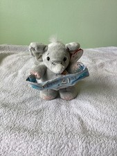 Elliot buttons elephant with - elliot,