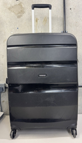 Dented american tourister - *dented*,