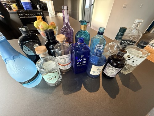 Empty gin bottles - empty,
