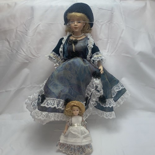Large porcelain doll and small - porcelain,