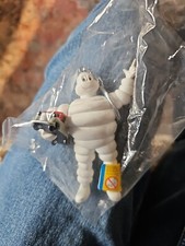 Michelin Man Bibendum holding