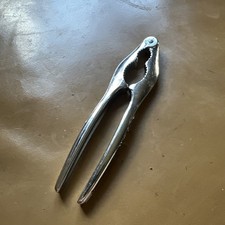 Bin  METAL NUT CRACKER ! MADE