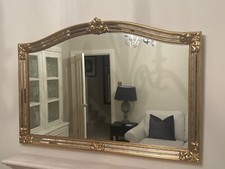large gold over mantle mirror