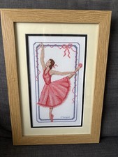 Framed cross stitch artwork of