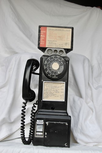 Vintage coin operated pay - coin,
