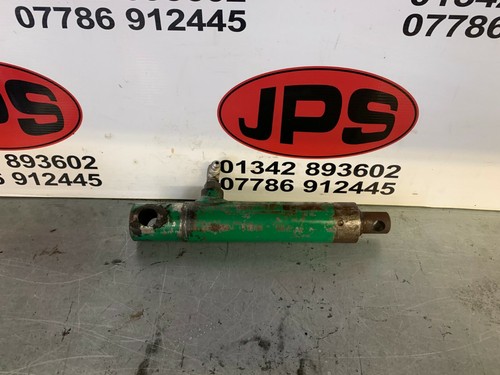 Front mowing cylinder lift ram
