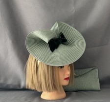 Stunning mint Fascinator with green bow and Matching Clutch Bag