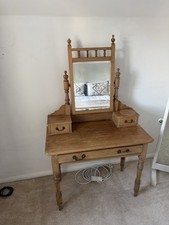 Antique pine dressing table with a tilt mirror and drawers.