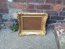 gold coloured  glazed picture frame for picture  11"  X 9" frame size 17" x 15"
