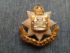#344 – THE EAST SURREY REGIMENT CAP BADGE – lugs