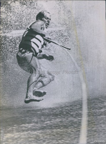 Vintage water skier executes - water, a