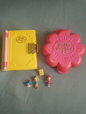 Two polly pocket toys Mr Frys Restaurant and Princess palace with figures.