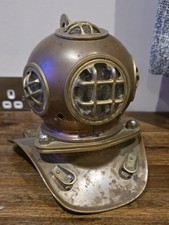 A Rolex diving helmet shop display stand for Submariner watch