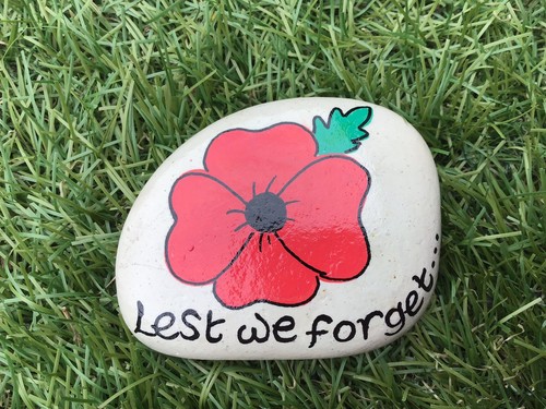 Hand painted poppy pebble - hand,
