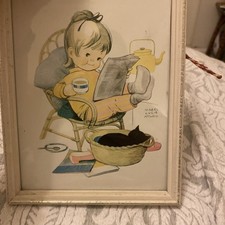 Mabel lucie Attwell print. Girl in chair with black cat in basket in a frame