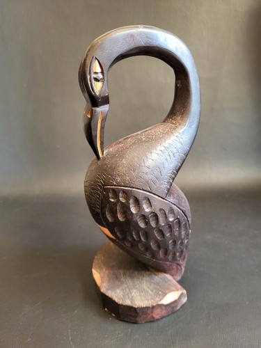 Inuit carved dark - carved, wooden