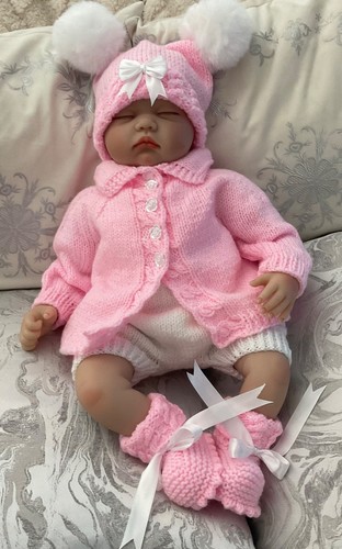 Hand knitted baby girl - hand, pink