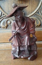 Vintage Rosewood Figurine Oriental Man; wearing hat & holding a pipe.