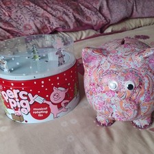 Piggy Bank 17x19x15cm and M&S Percy pig musical rotating tin 17.5x15cm
