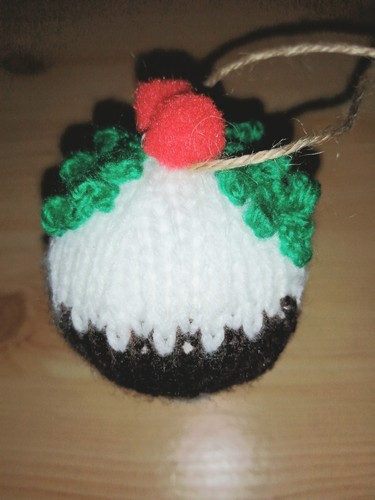 Hand knitted christmas pudding - hand,