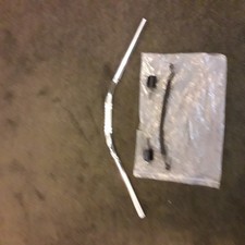 Suzuki SV650 low rise chrome handlebars, bar end weights and top brake hose.