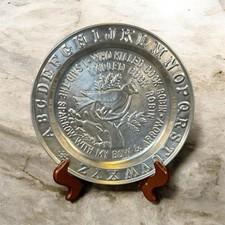Embossed tin alphabet plate