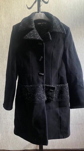 Black coat with white detail